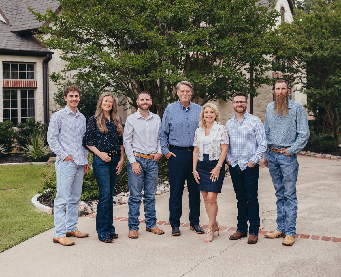 The S&B Roofing & Exteriors leadership team outside a Keller-area home